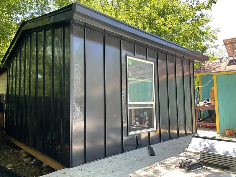 Black standing seam metal wall panels for Roof Inspection in Olive